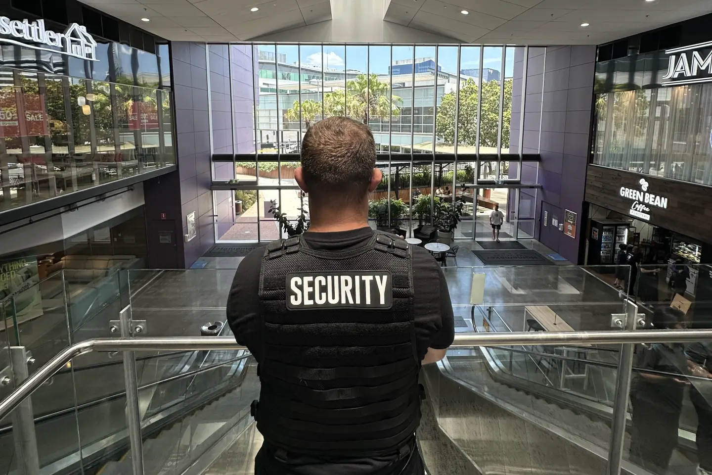 Elite Squad officer overlooking the atrium of a Brisbane homemaker centre