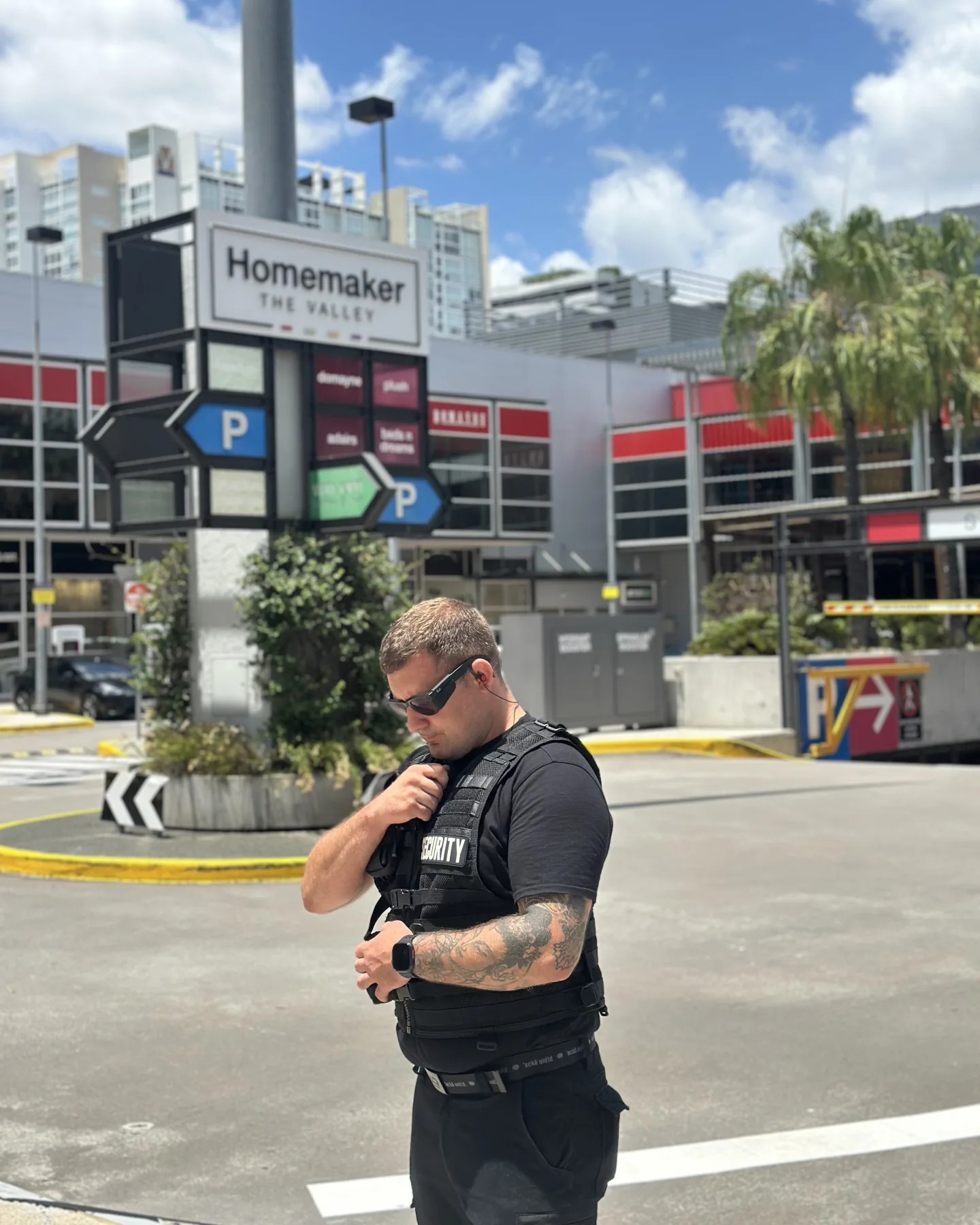 Elite Squad officer on the radio at the entrance of a Brisbane homemaker centre