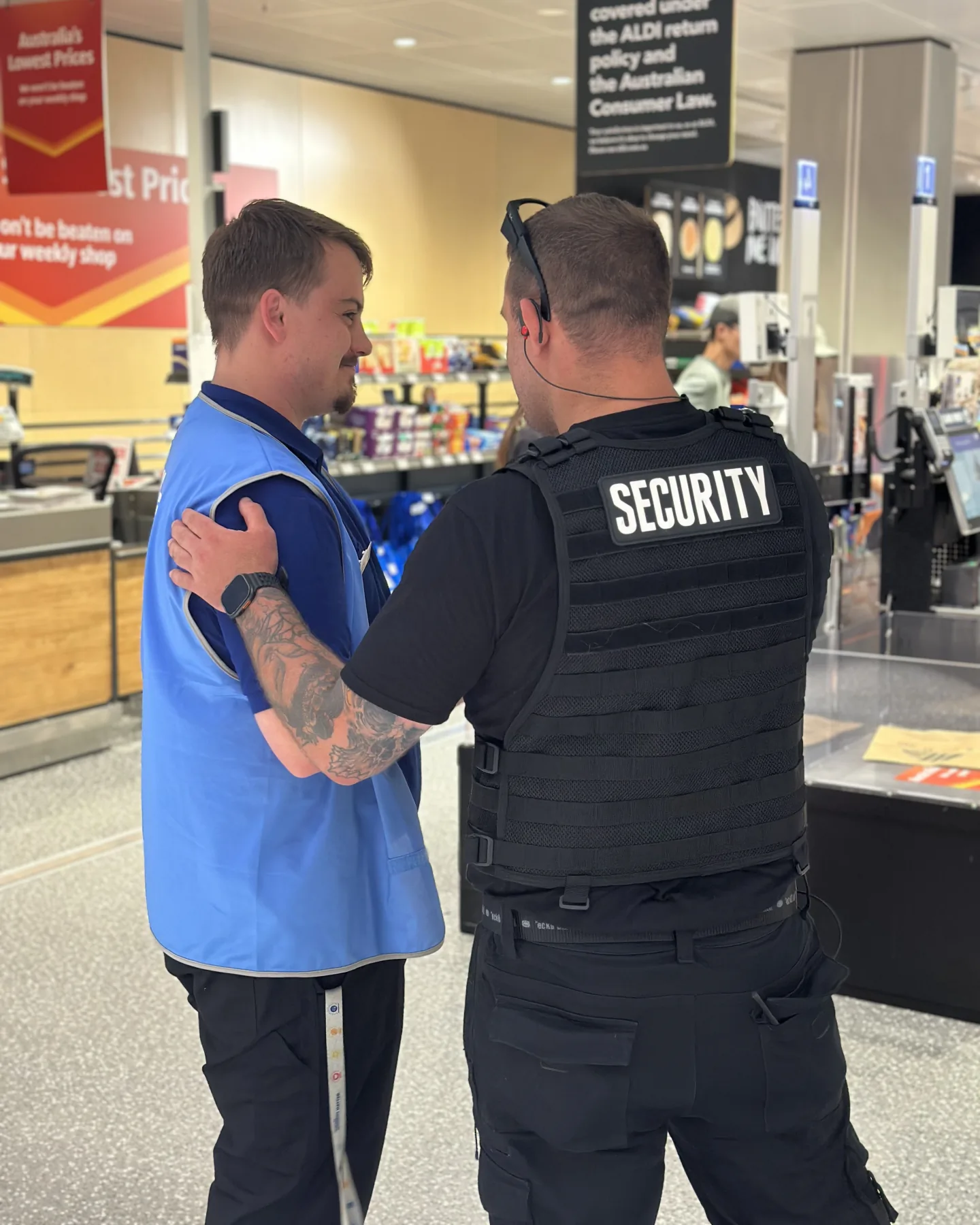 Elite Squad officer talking with a retail team member on the shop floor